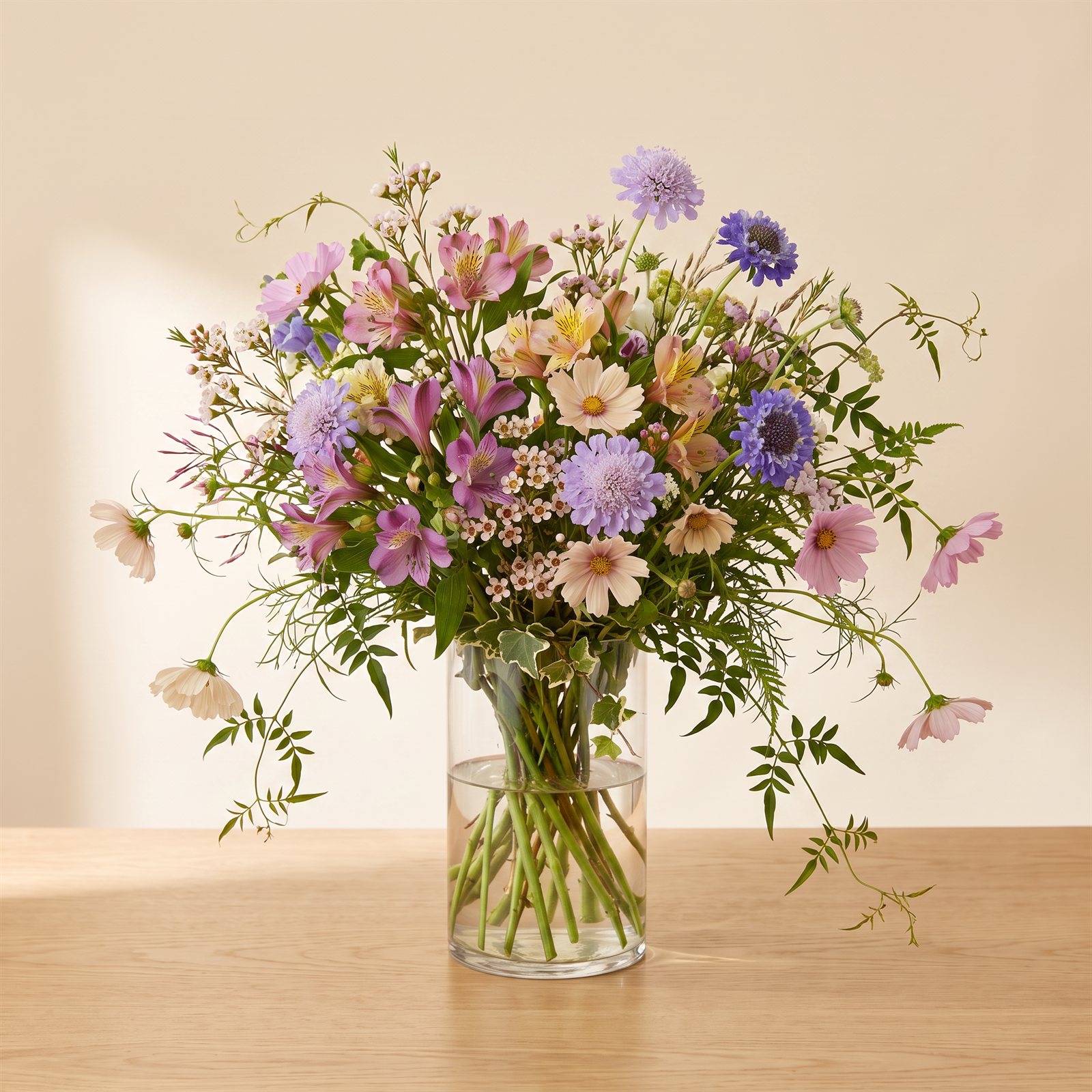 Garden-style arrangement with wild greenery and summer blooms, grand size